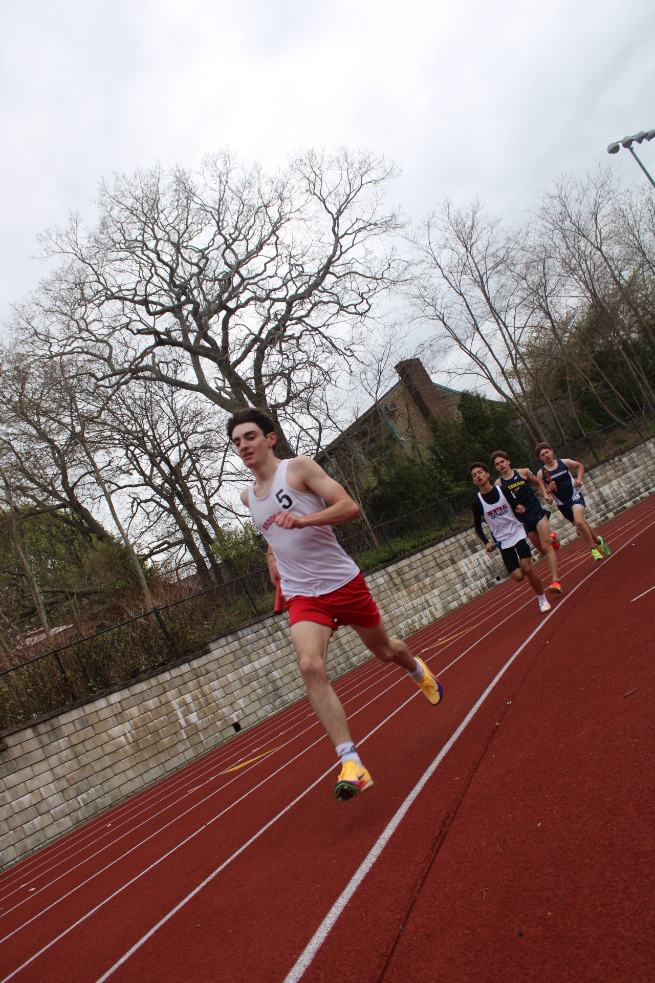 Brookline runner racing on the track