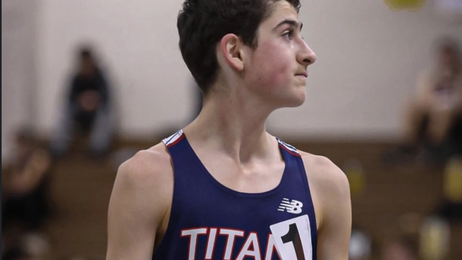 Pembroke runner at an indoor track meet